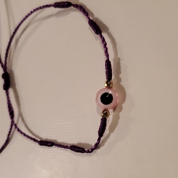 Pink Evil eye bracelet with purple string - Picture 2 of 2